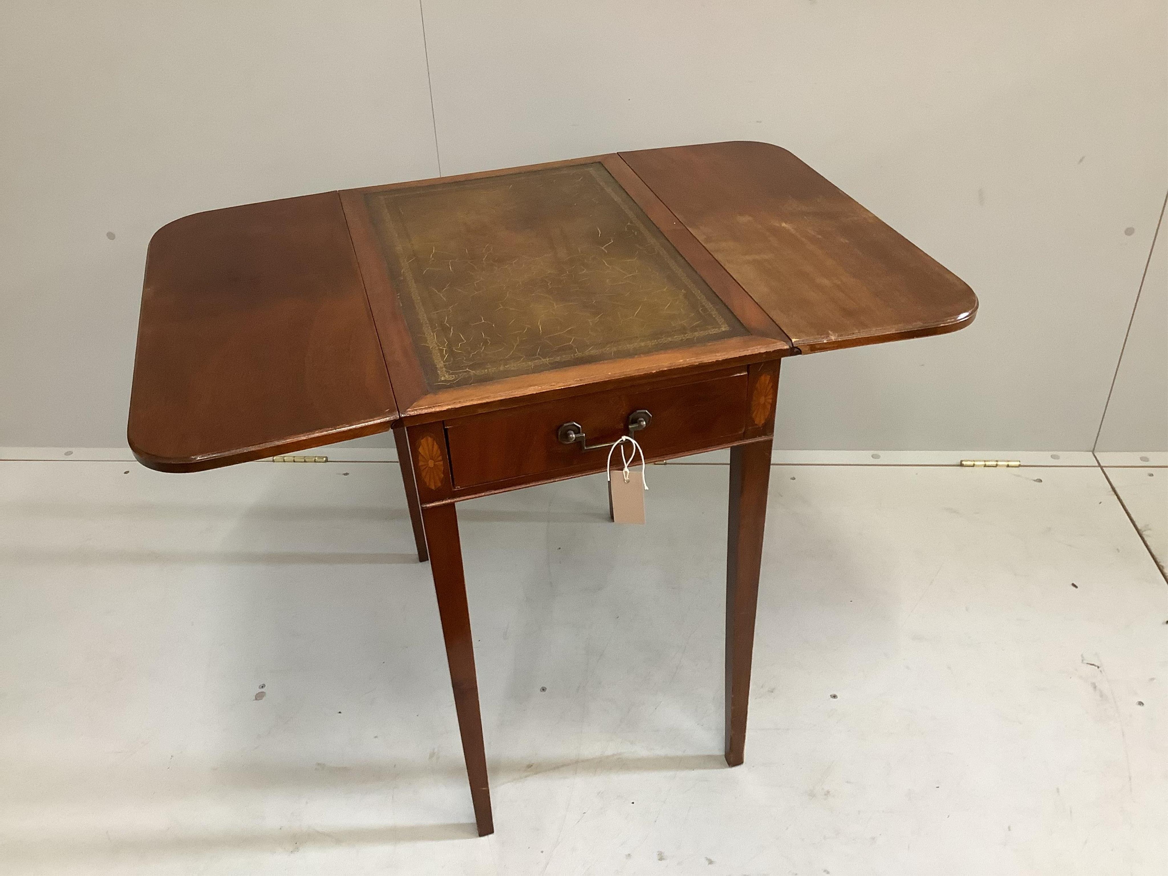 A reproduction George III style mahogany Pembroke table with leather inset top, width 61cm, depth 34cm, height 68cm. Condition - fair